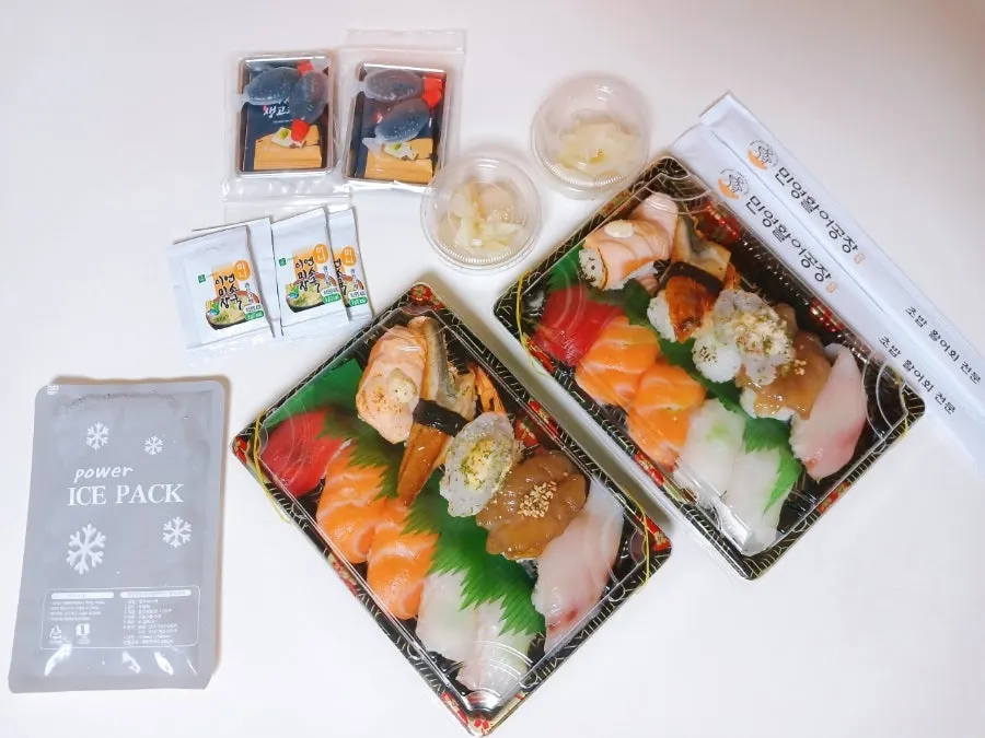 Sushi boxes being prepared for takeout