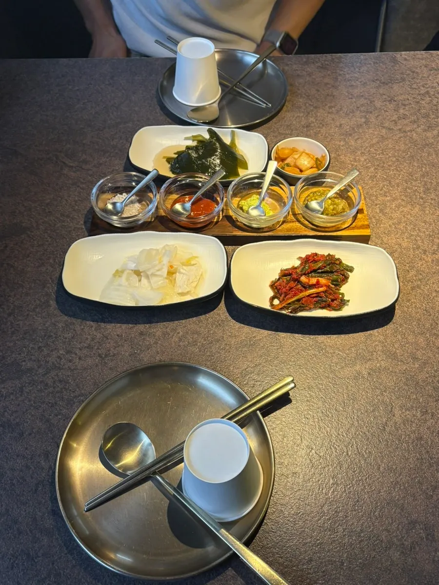 Basic banchan setup of myeongi-namul, baek-kimchi, and pa-kimchi