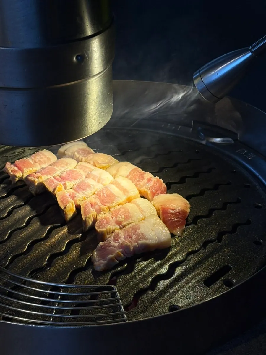 Dry-aged pork belly grilled by staff