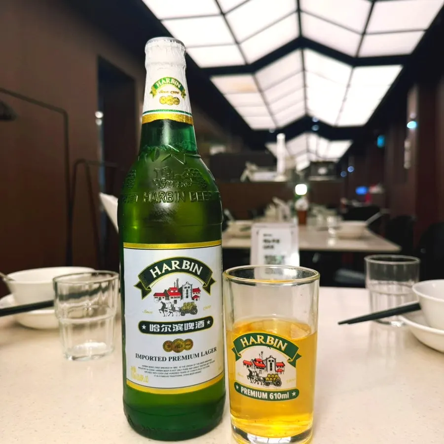A cold glass of Harbin beer poured