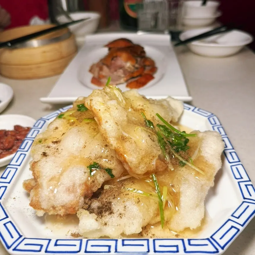 Table set with Peking duck and beer glasses