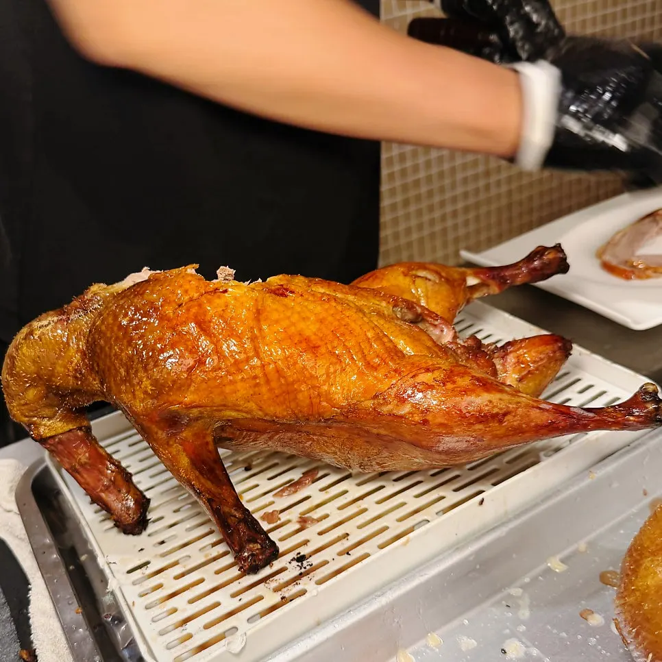 A plate of Peking duck showing crispy skin