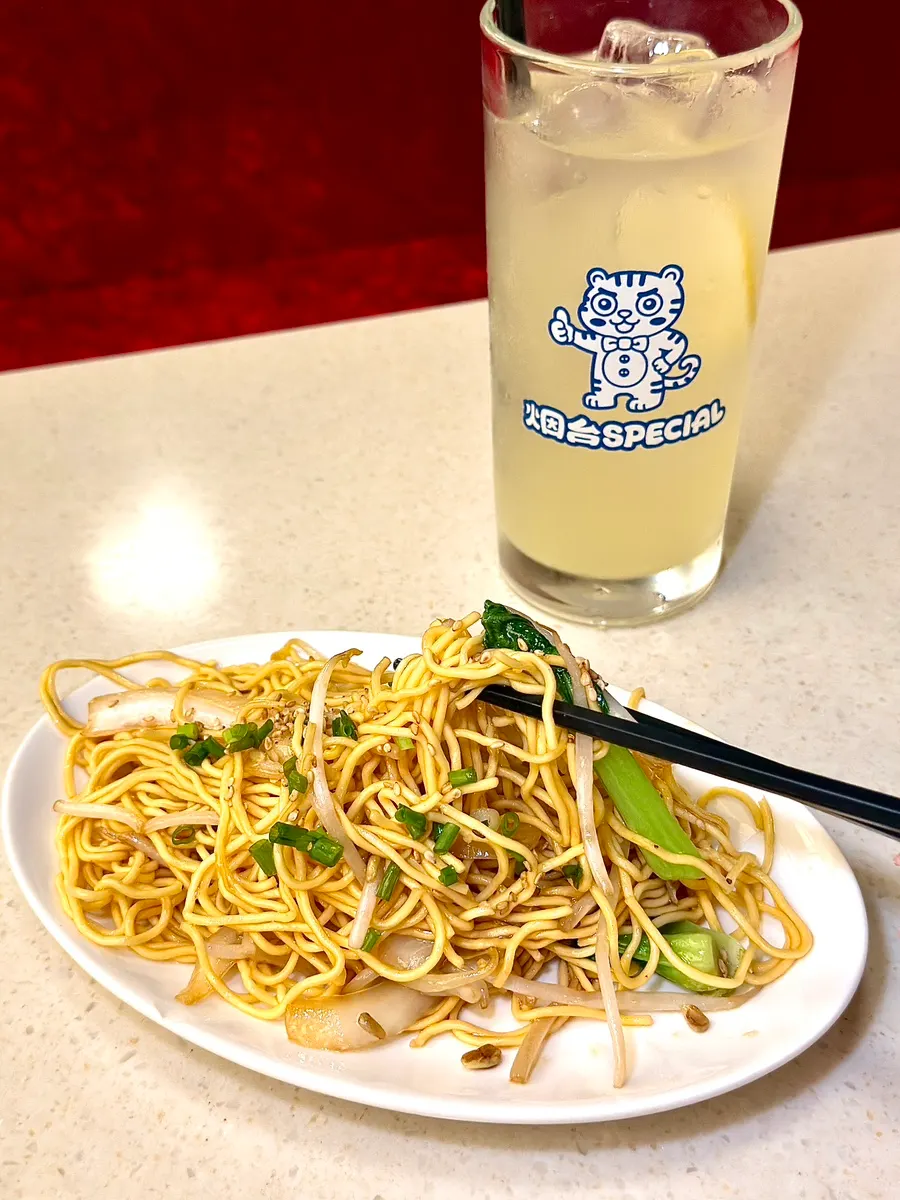 Noodles with chicken and bean sprouts in the egg noodle stir-fry