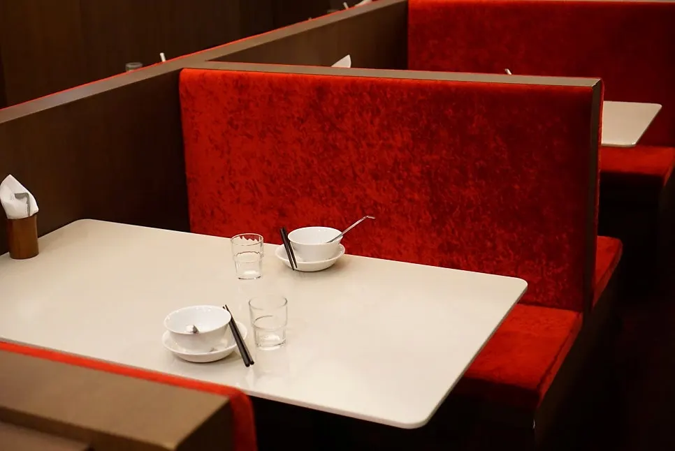 Seating divided by a partition with a kid's chair