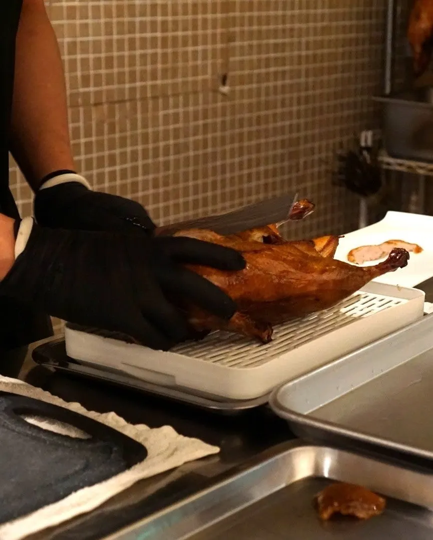 Peking duck sliced immediately after ordering
