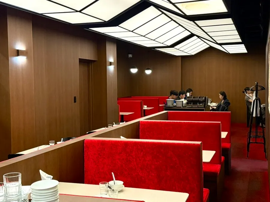 Interior of Mirim Yangjang Apgujeong with red chairs