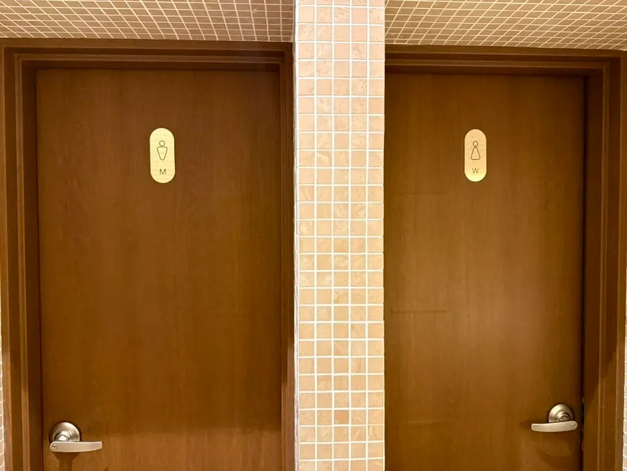 Entrance to the separate men's and women's restrooms inside the restaurant