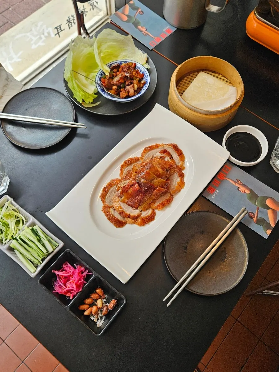 Close-up of a crisp-outside, juicy-inside piece of Peking duck