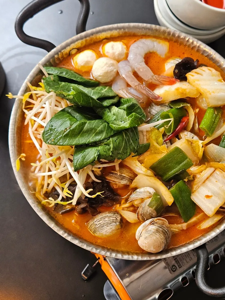 Mirim mala soup bubbling on the burner
