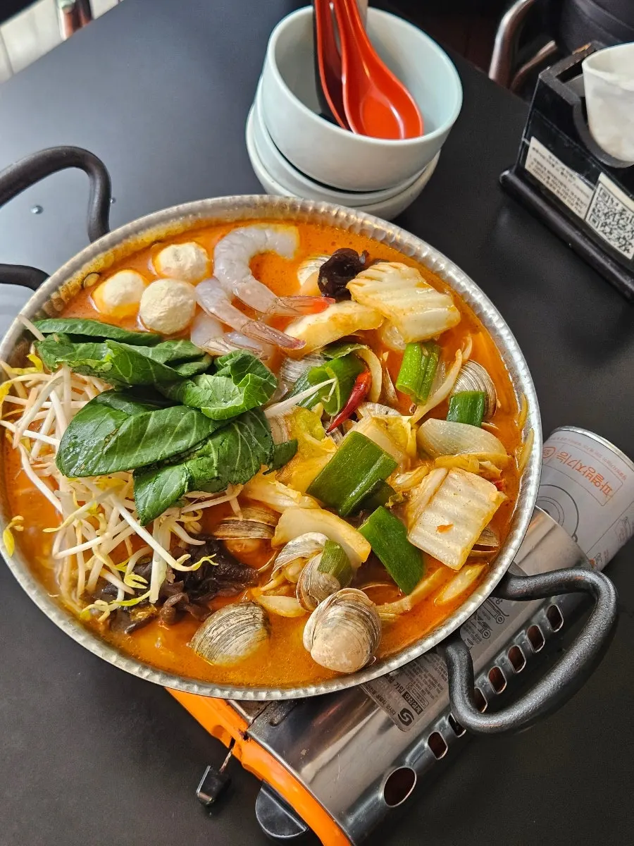 Mala soup broth loaded with seafood and vegetables