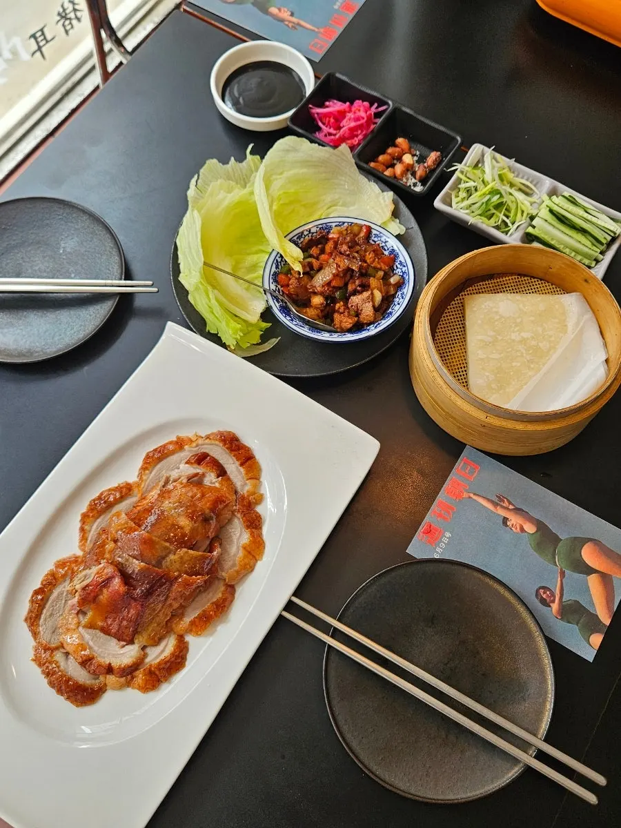 Table set for two with the duck wrap set and mala soup