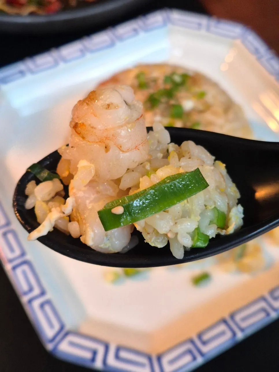 A spoonful of shrimp fried rice