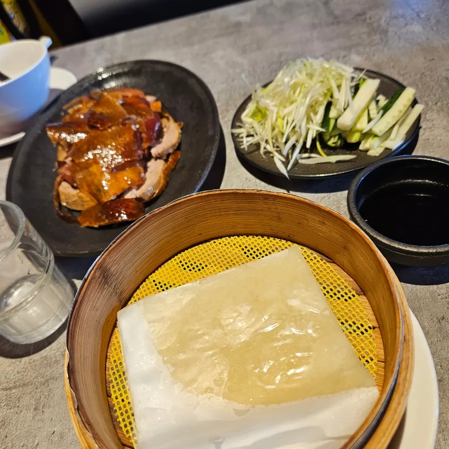 Duck meat and skin arranged on a plate