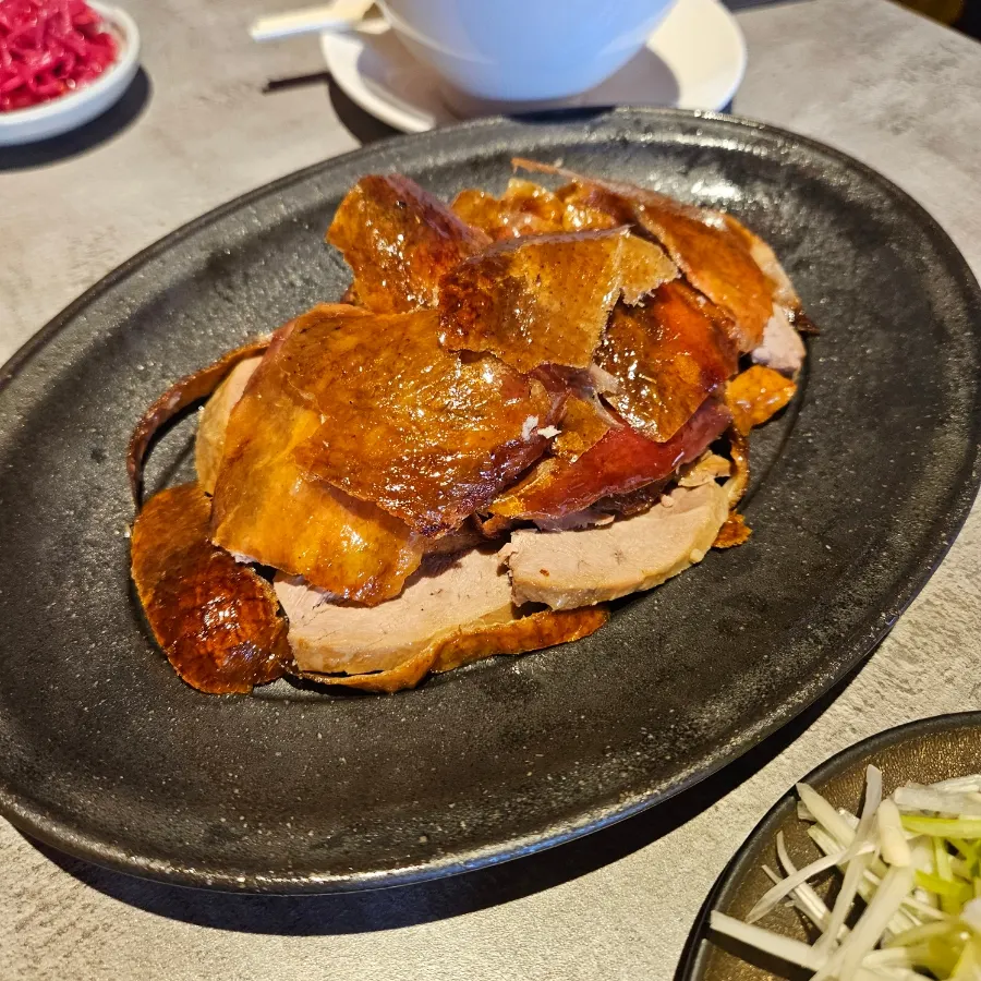Plate of yajang sauce with scallion and cucumber strips
