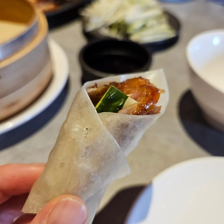 Scallion and cucumber strips that cut through the richness
