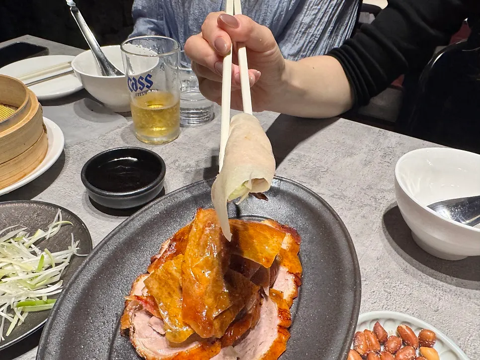Pancake wrapped with duck and scallion strips