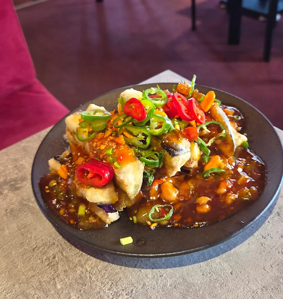 Eggplant fritters with spicy sauce