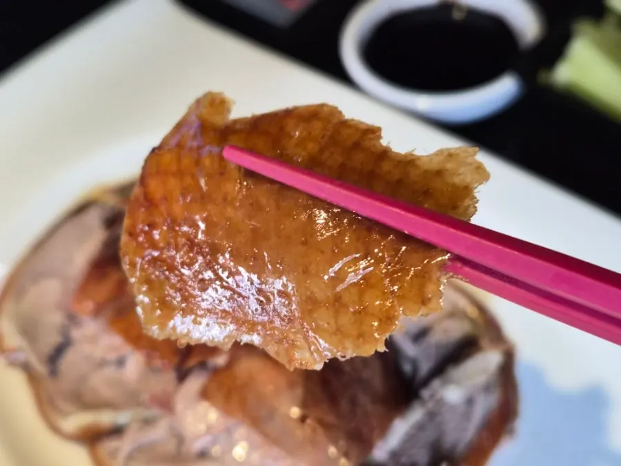 Peking duck and vegetables placed on a wheat pancake