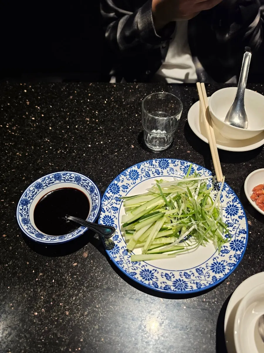 Half Peking duck with pancakes in a steamer