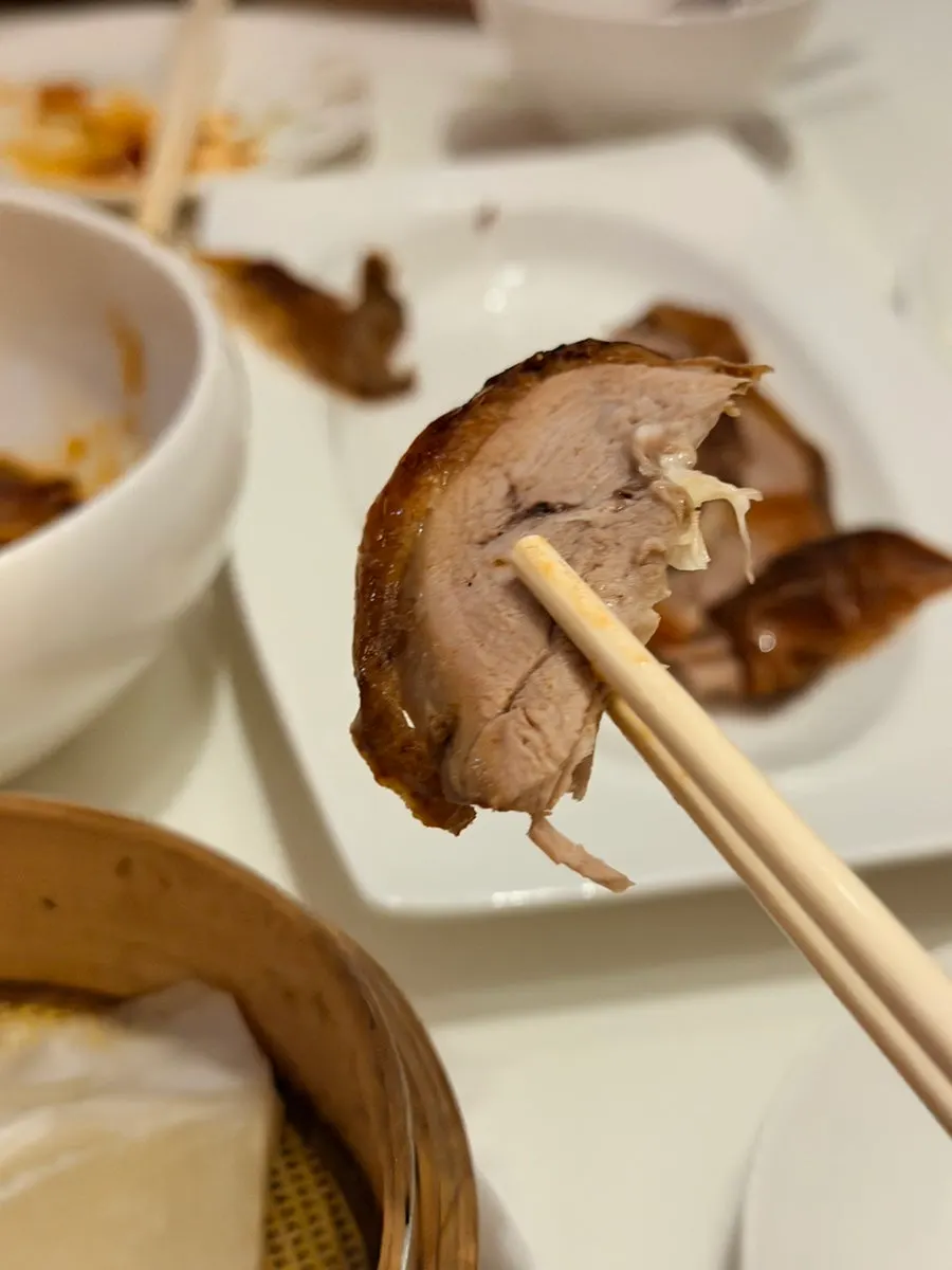 Full table setting of half Peking duck