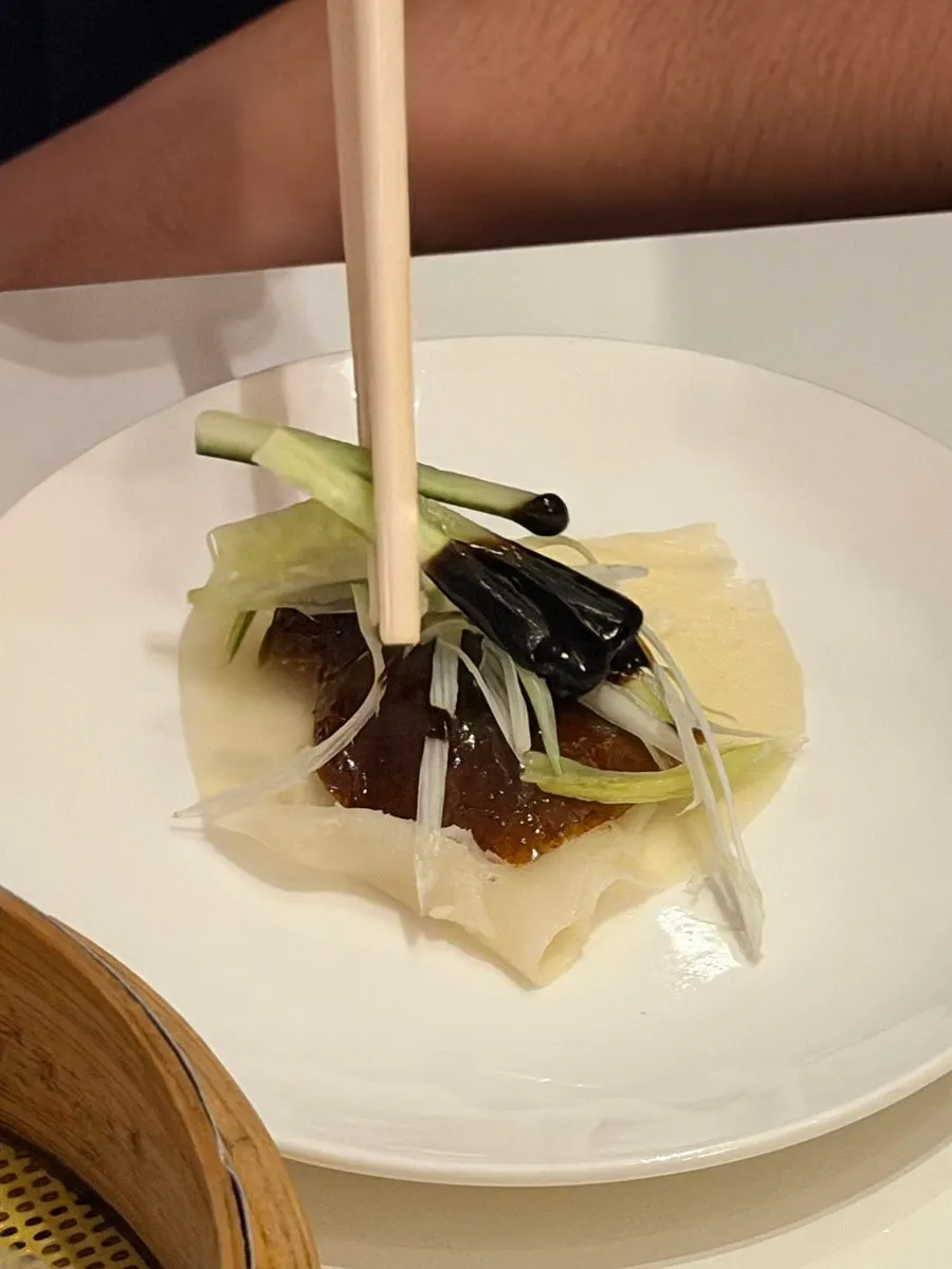 Peking duck wrap made with the crispy skin included