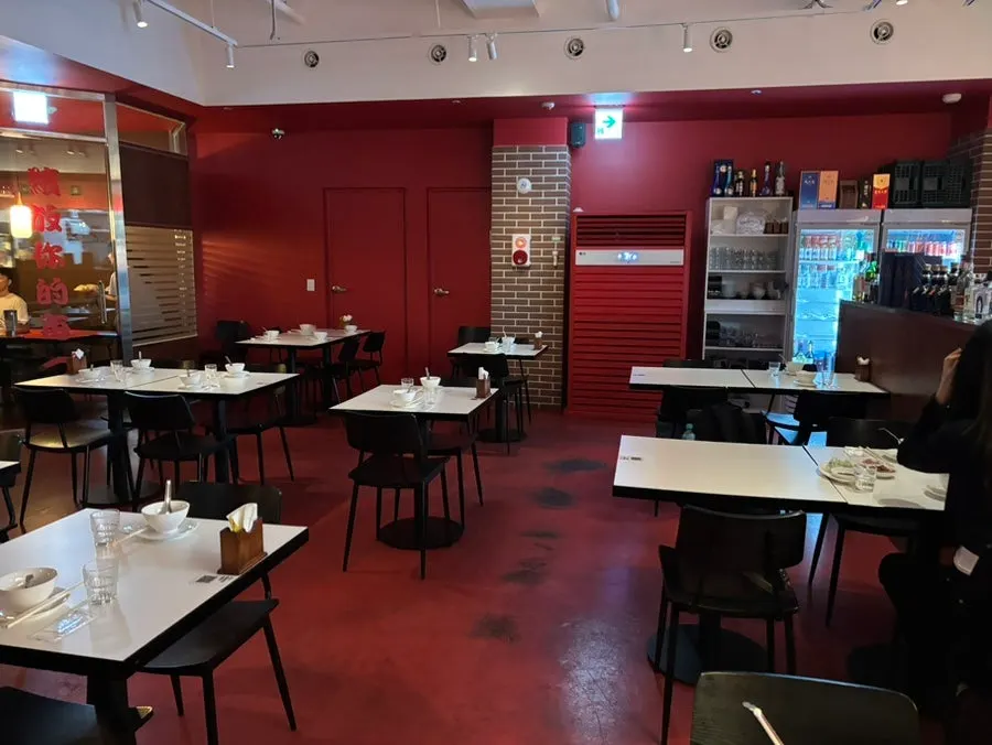 Basement interior of Mirim Yangjang Seolleung Branch with red decor