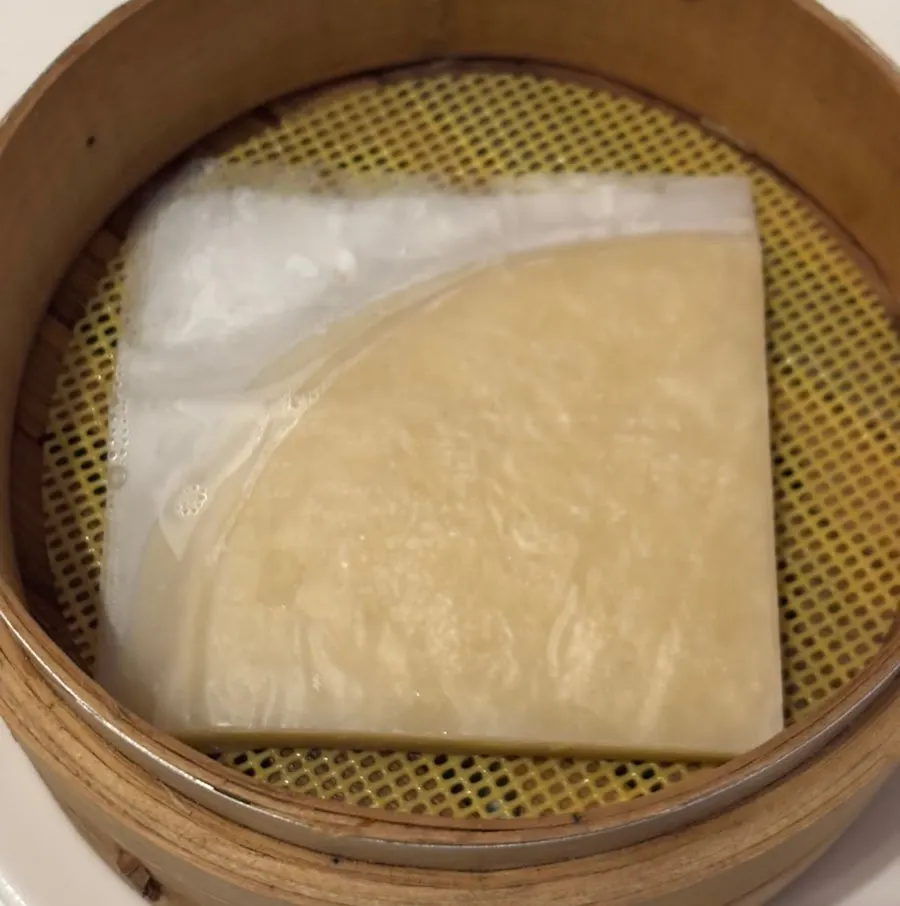 Warm steamed wheat pancakes served on the side
