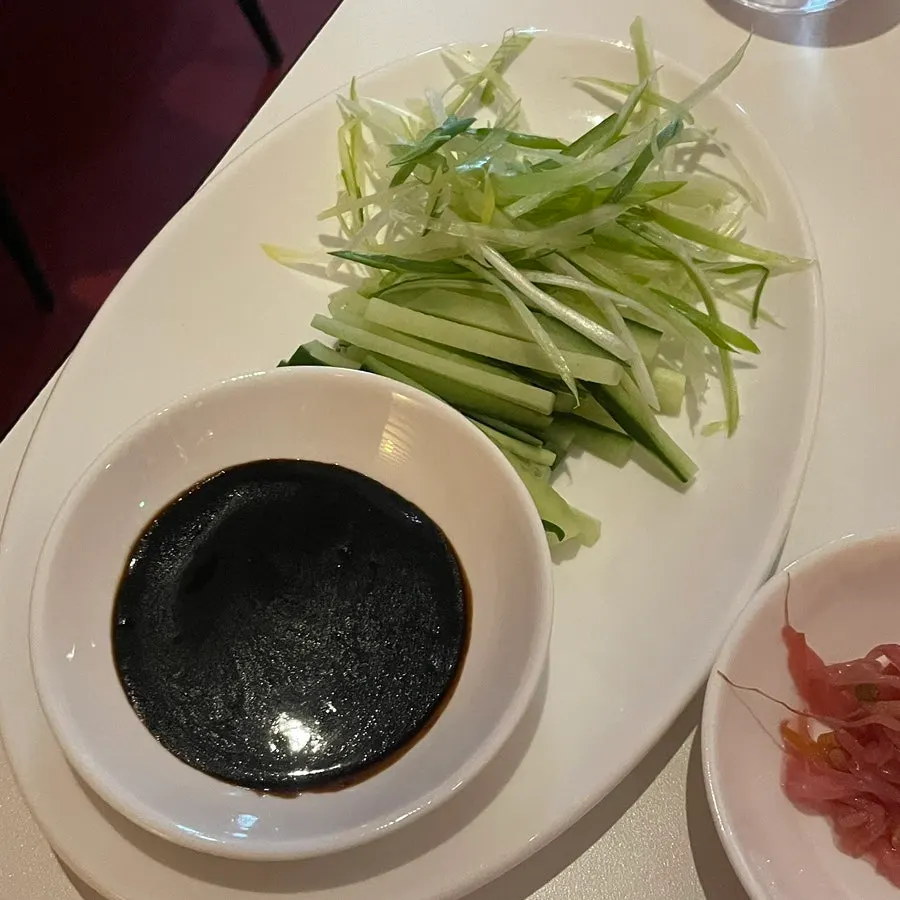Peking duck table setting prepared by staff