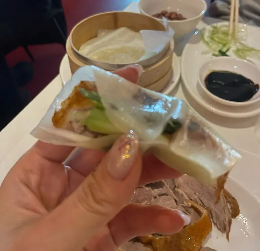 Peking duck wrapped in a wheat pancake