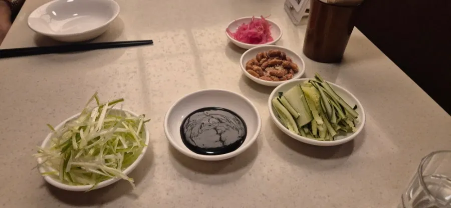 Terra beer with peanuts and bean sprout pickles as banchan