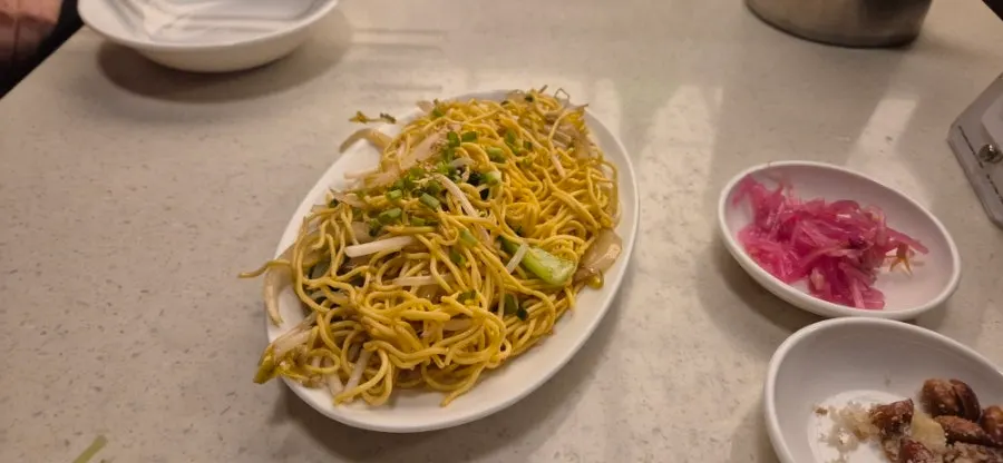 Sugared peanuts and bean sprout pickles served as banchan