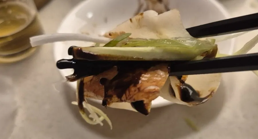 Yajang sauce served with scallion strips and cucumber
