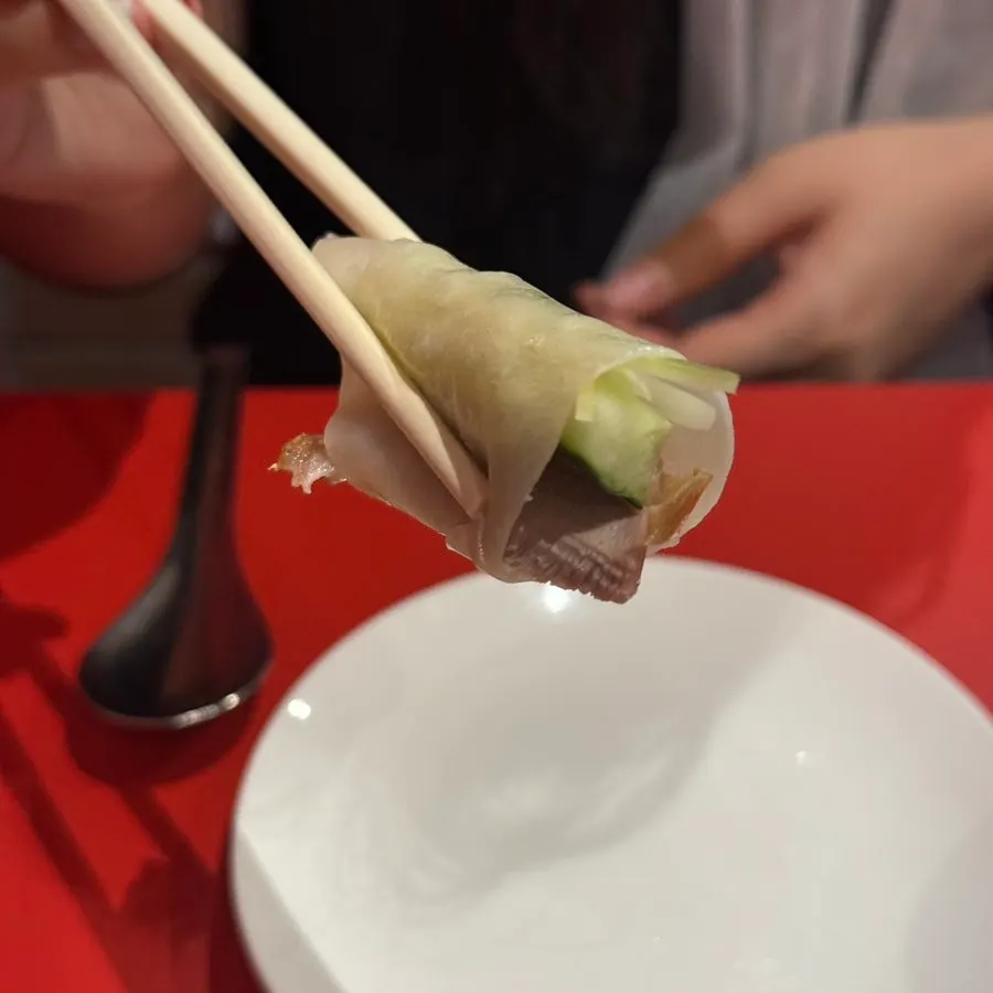 A wrap of duck and vegetables in mil-jeonbyeong