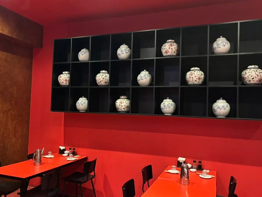 Seating area at Mirim Yangjang with coat hooks
