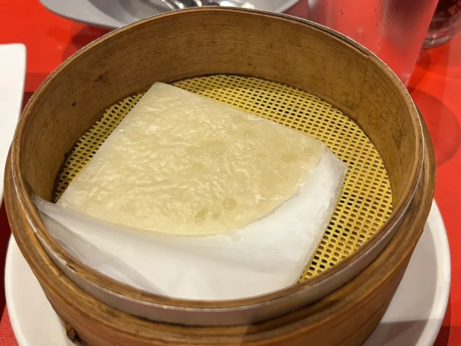 Wrapping Peking duck in a thin pancake