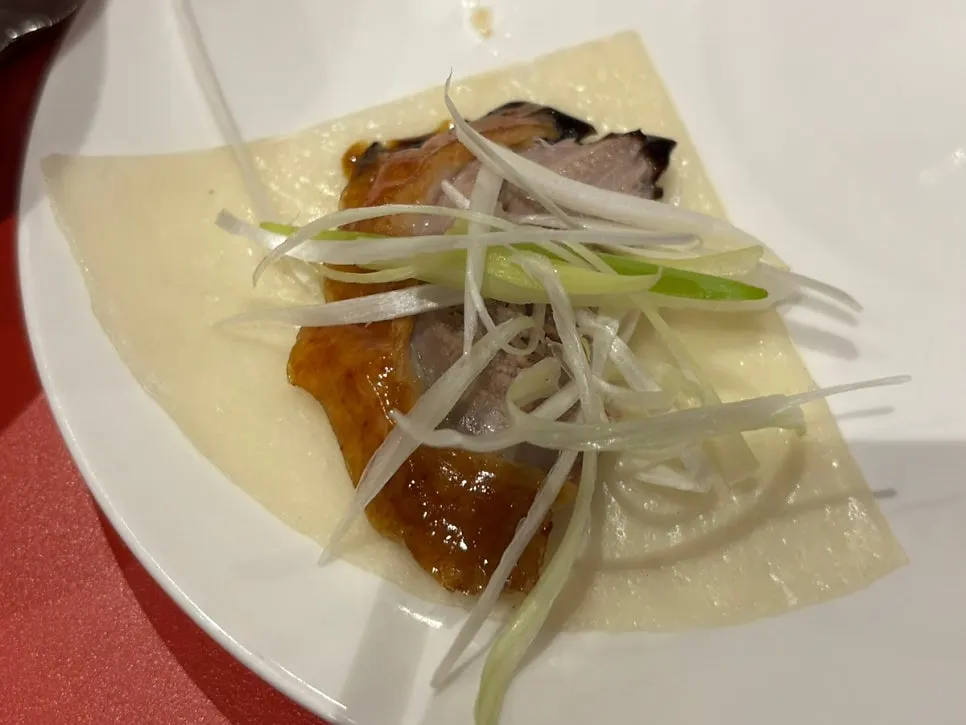 Peking duck and jjamppong placed together on the table