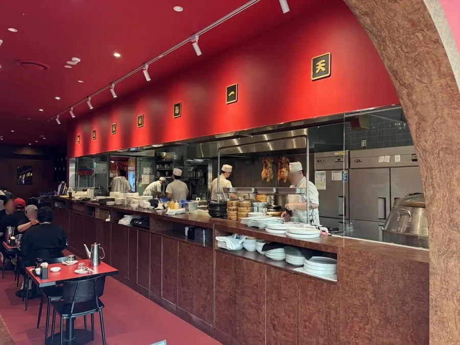 Kitchen staff cooking at Mirim Yangjang's open kitchen