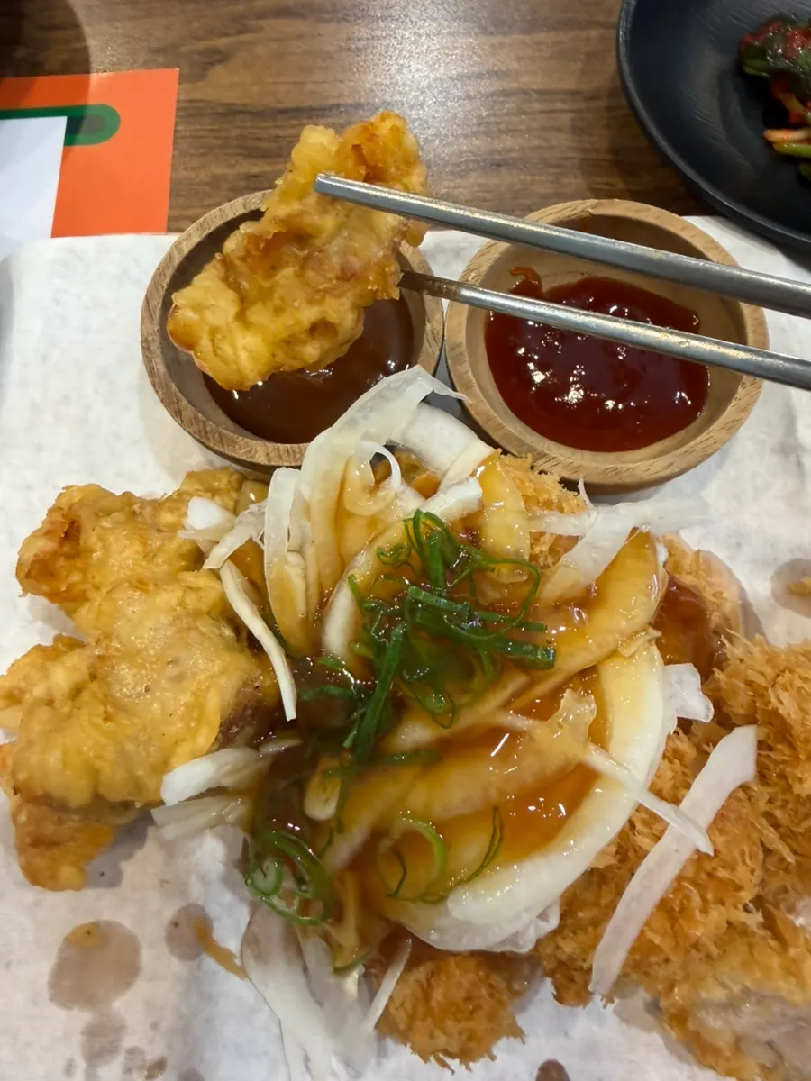 Dipping sweet and sour pork into the sauce