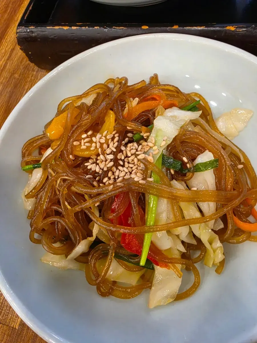 Fried food and japchae served with the loach soup set