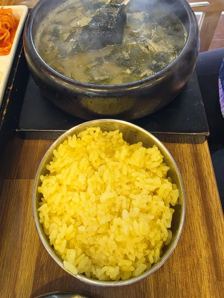 Eating the turmeric rice together with the loach soup