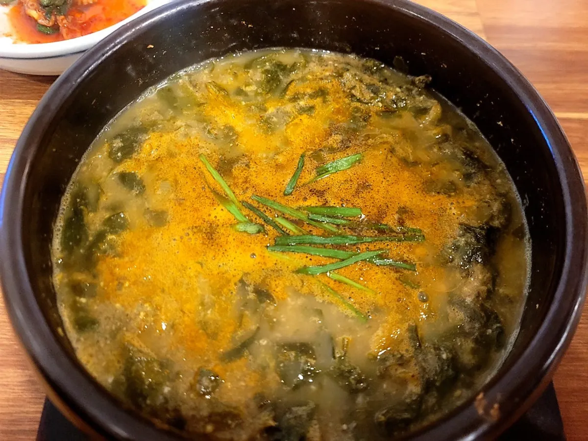 A bowl of thick, ingredient-heavy South Jeolla-style loach soup