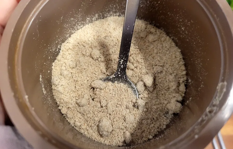 A spoonful of loach soup mixed with seasoning