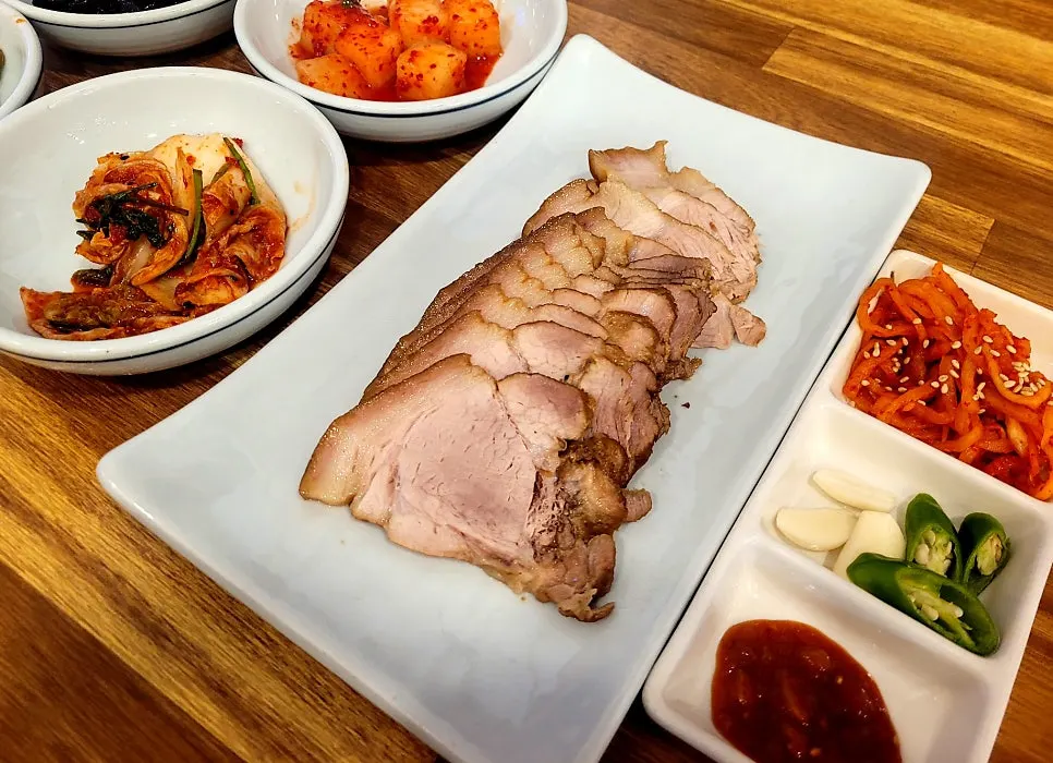 Lunch table with loach soup and boiled pork together
