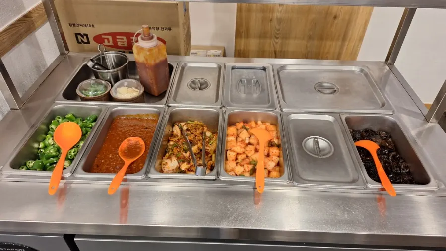 Self-serve bar with kimchi, radish kimchi, and ssamjang