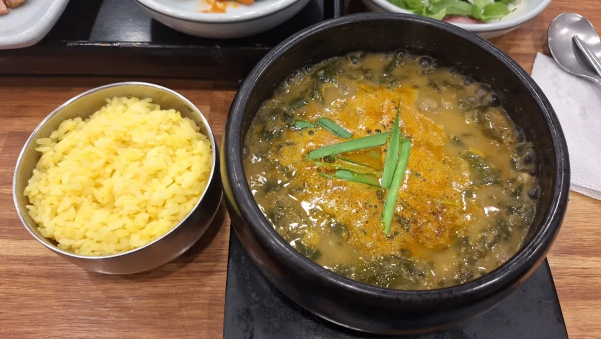 Loach soup served with turmeric rice