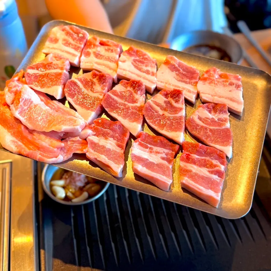 Plated raw pork belly and raw pork jowl