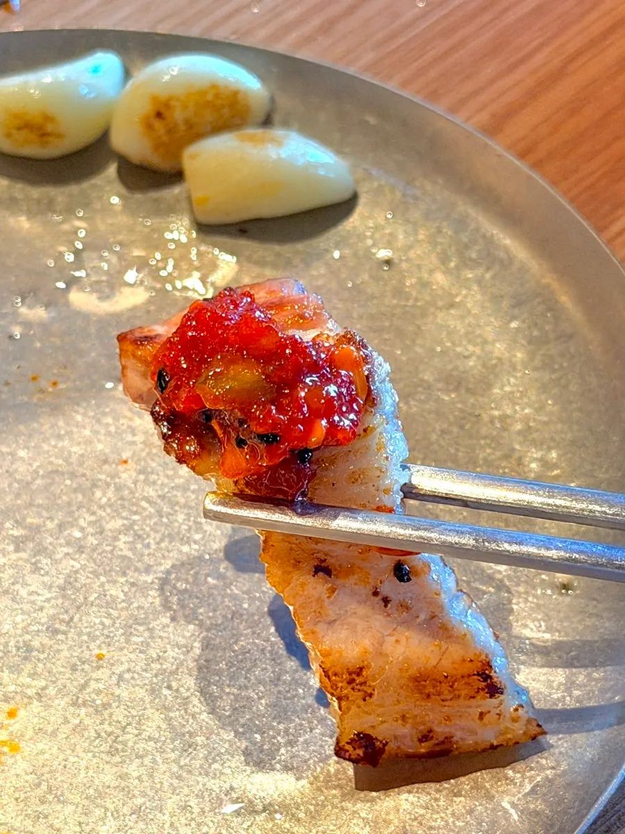 Pork jowl served with Ganggyeong seed jeotgal