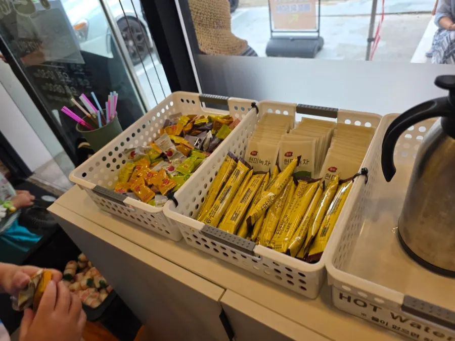 Yogurt, candy and coffee set out at the entrance