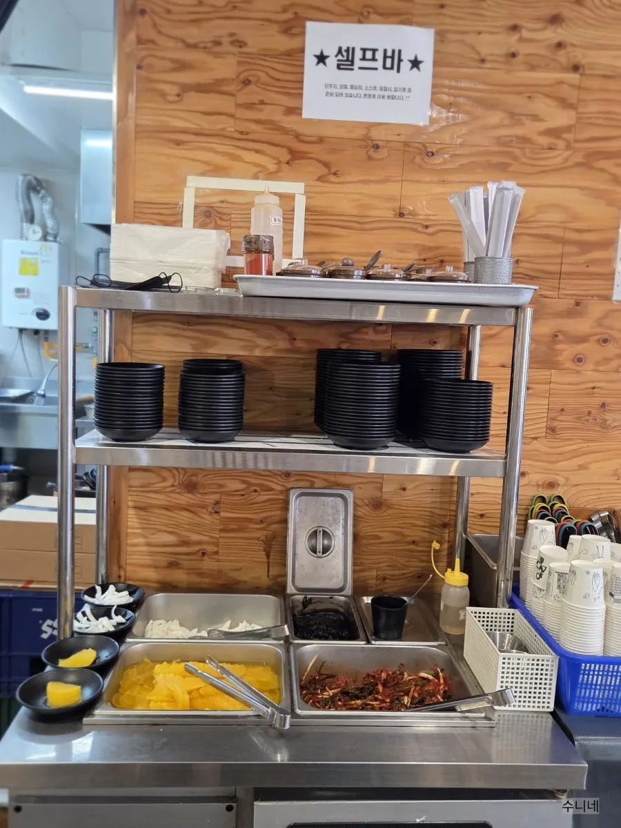 Self-serve bar with side dishes and rice