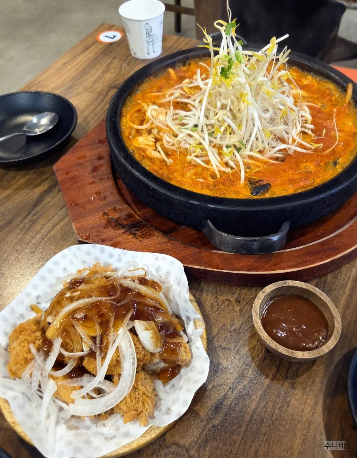 Full table spread of stone-plate jjamppong and homemade donttang set